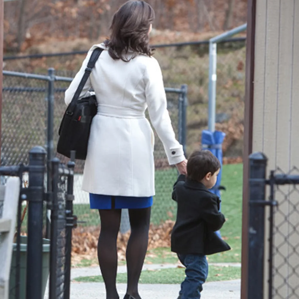 A child being dropped off at Peace of Mind daycare by his mother