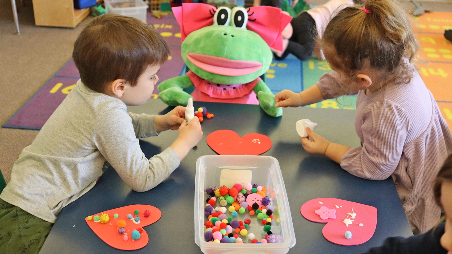 A child playing with a large stuffed animal at Peace of Mind