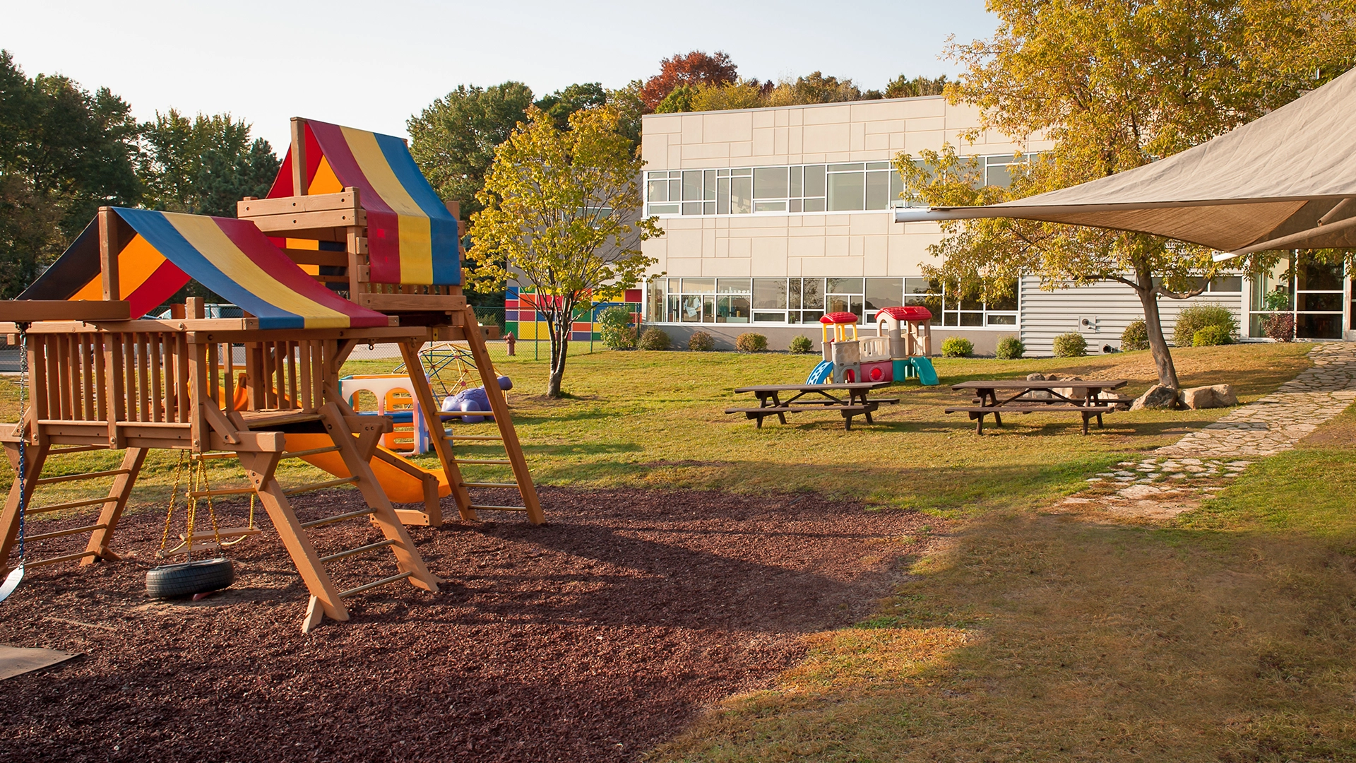 Playground area and rides outside of Peace of Mind daycare
