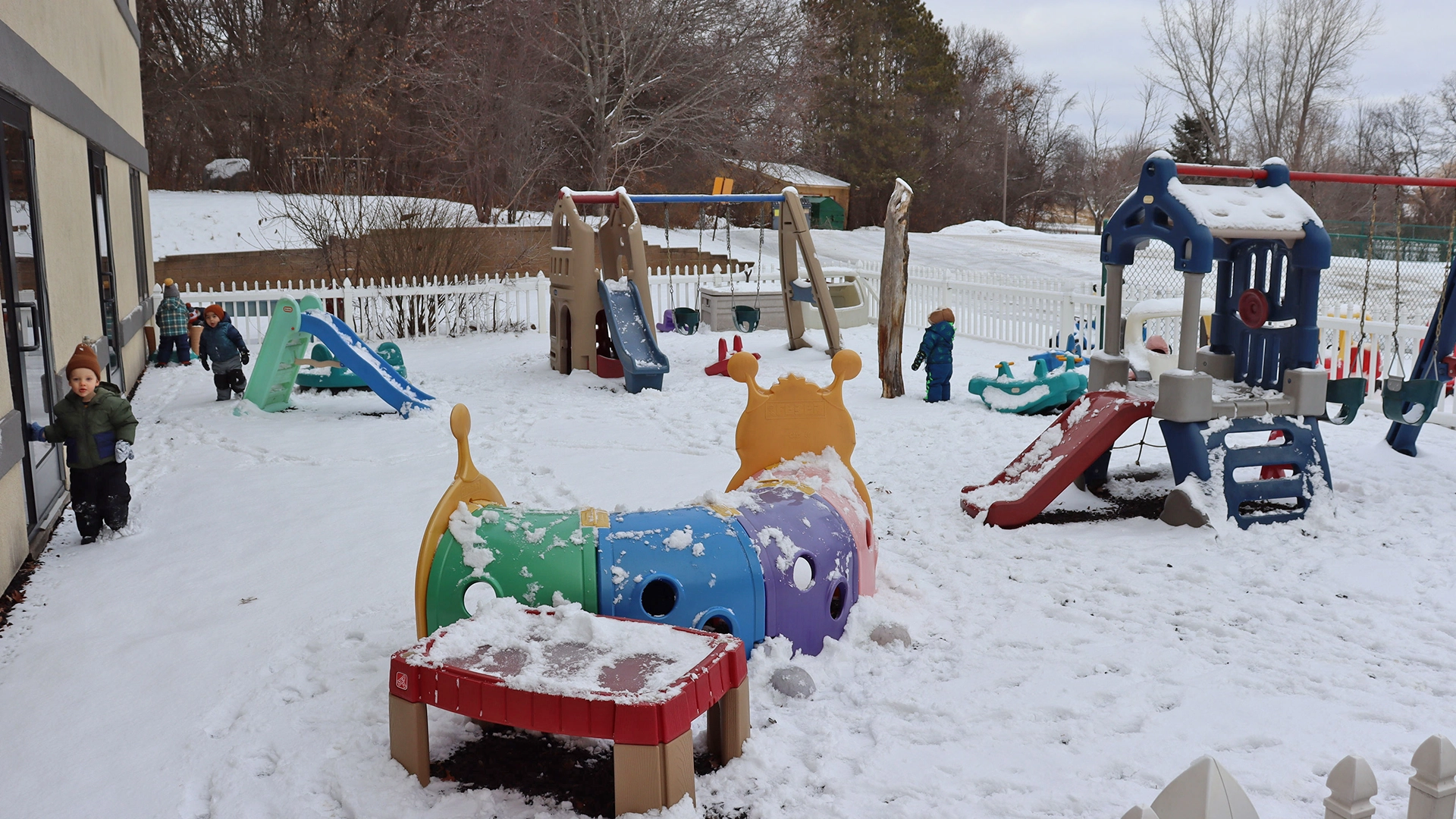 A play area covered in snow outside of Peace of Mind daycare