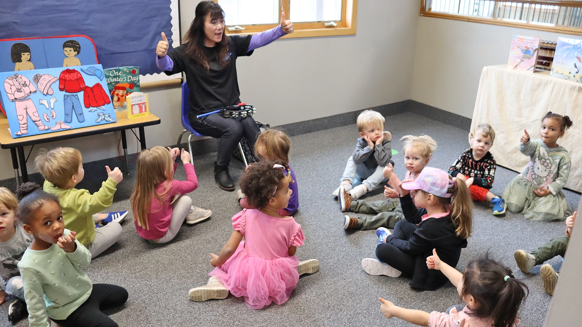 A teacher guiding kids during a lesson at Peace of Mind